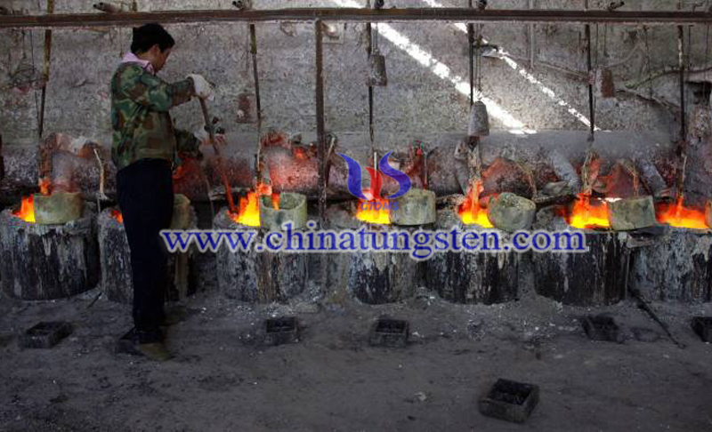 China produces 80 percent of the global rare earths and a worker at the smelting workshop image